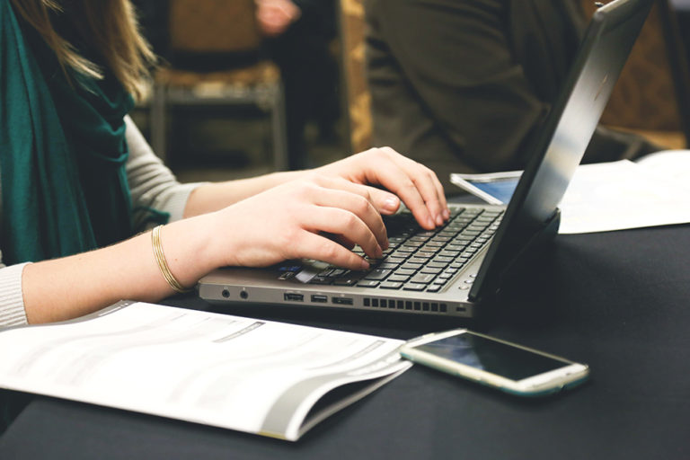 a person typing on a computer