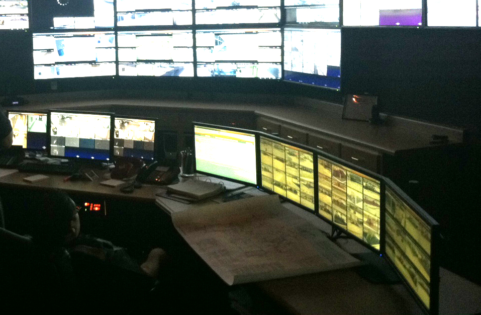 a control center with many monitors