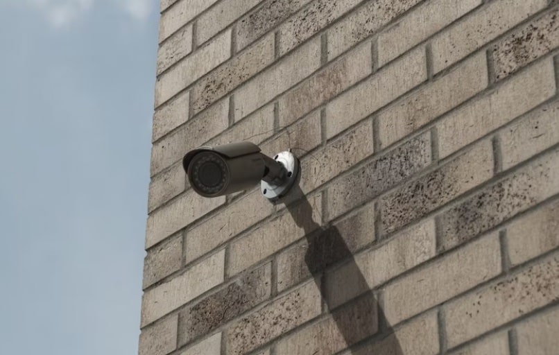 Video Surveillance on a brick wall outside of a building
