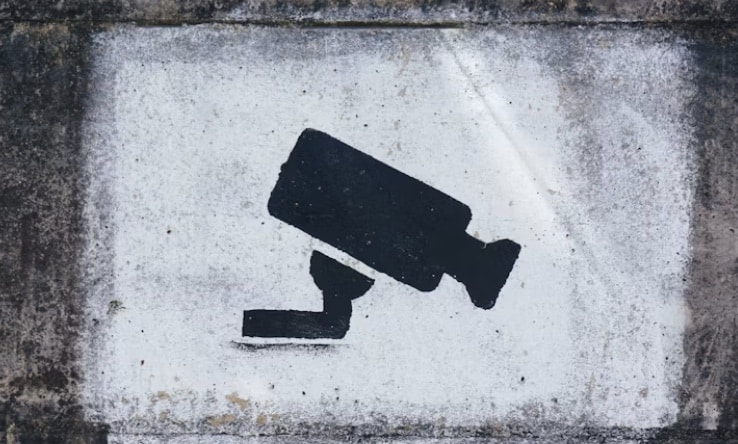 a spray painted video camera on concrete