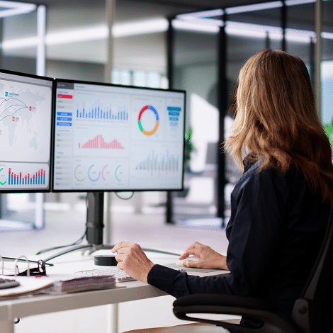 Woman working on computer at office.